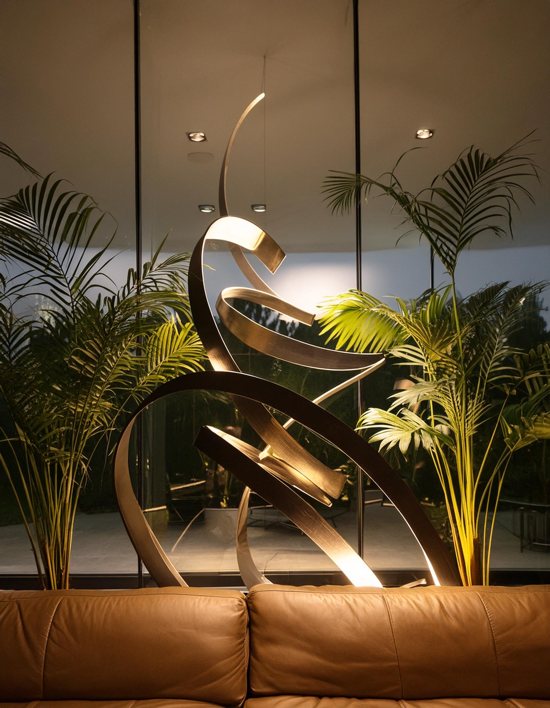 Firefly photo of a high end glass accent wall piece inside a luxury hotel lobby interior, dramatic l (1).jpg